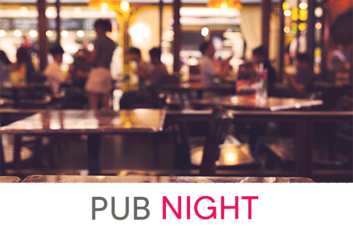 blurred image of people in pub