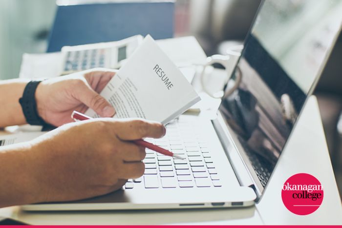 a photo of someone looking at a resume