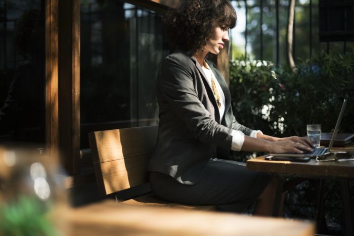 Woman typing on Laptop