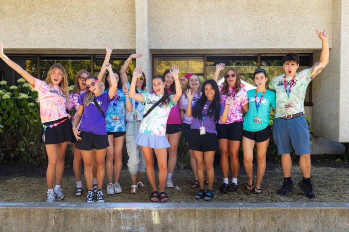 Staff team with hand up