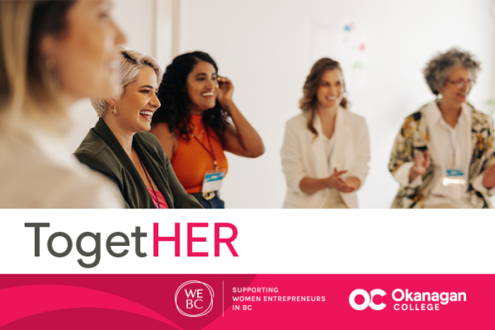 Group of diverse women gathered together and smiling in a bright indoor space