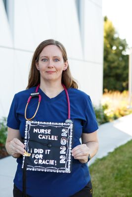 Caylee Donovan holding her graduation cap