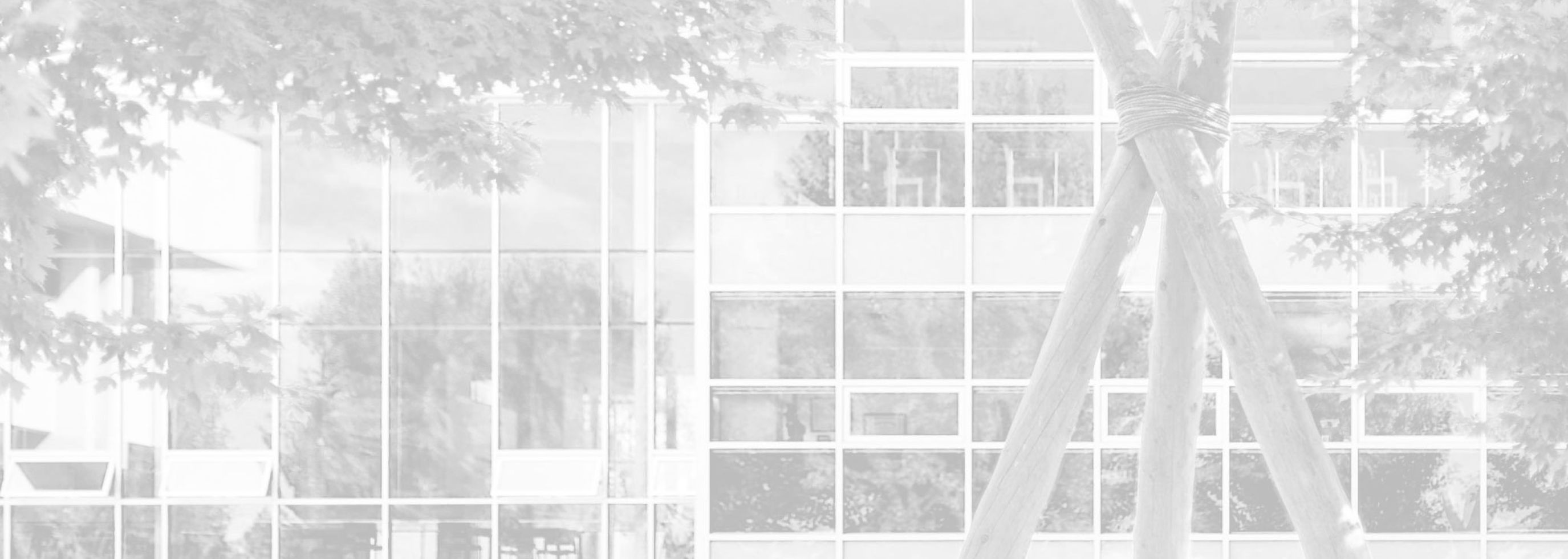 Black and white background photograph of the Centre for Learning building on the Kelowna campus