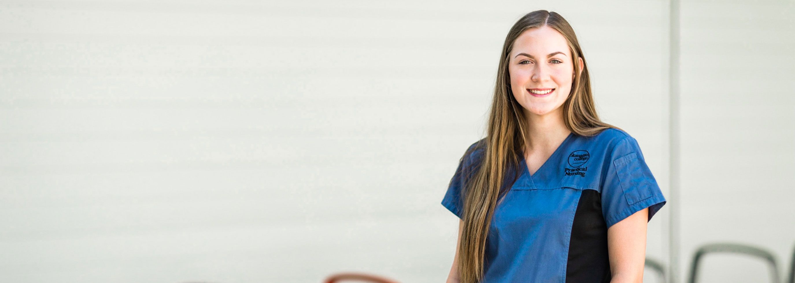 Health student wearing a blue and black uniform