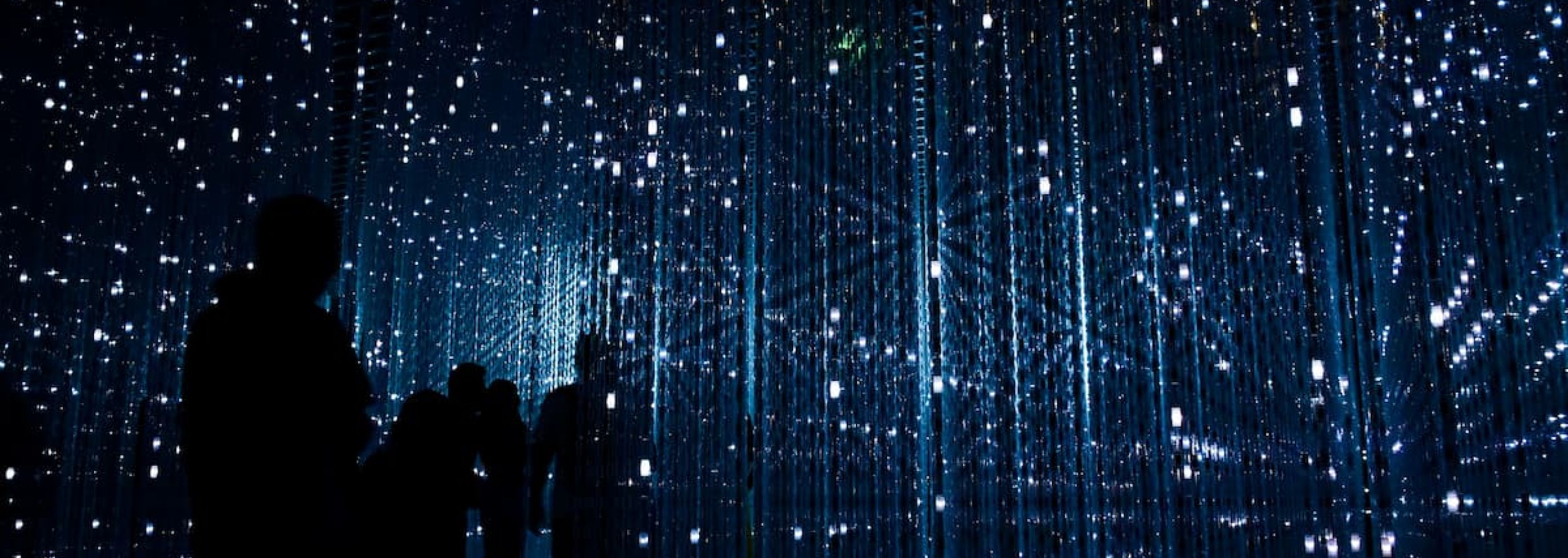 a group of people standing next to each other at artscience museum in Singapore