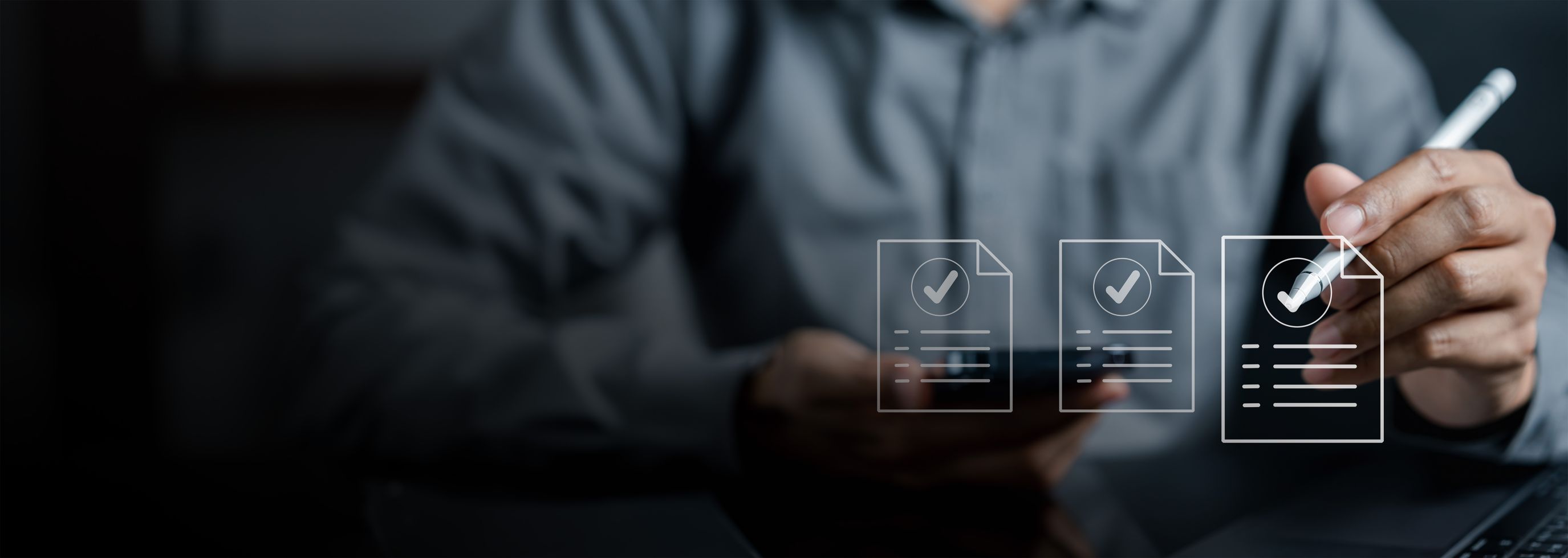 Graphic of three checklists with person holding pen in background