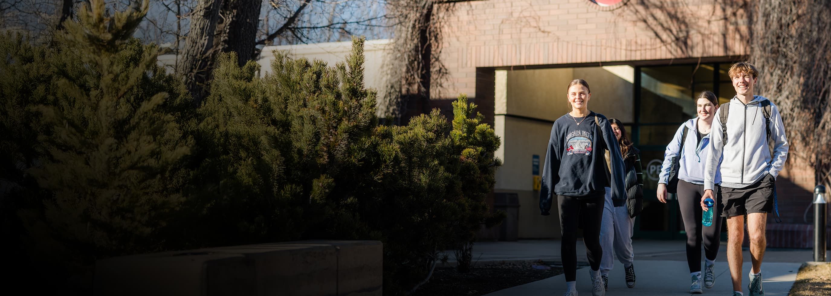 Students walking in front of an OC building