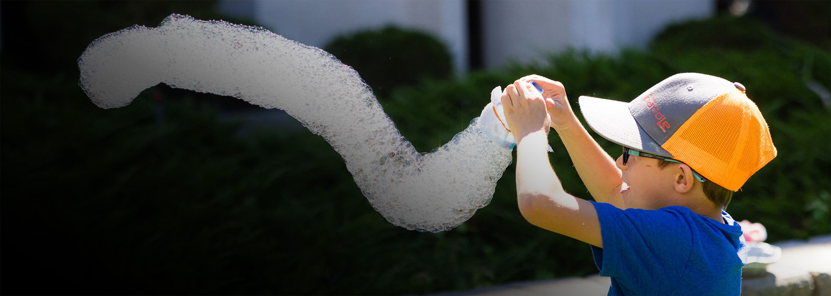 child playing with bubbles