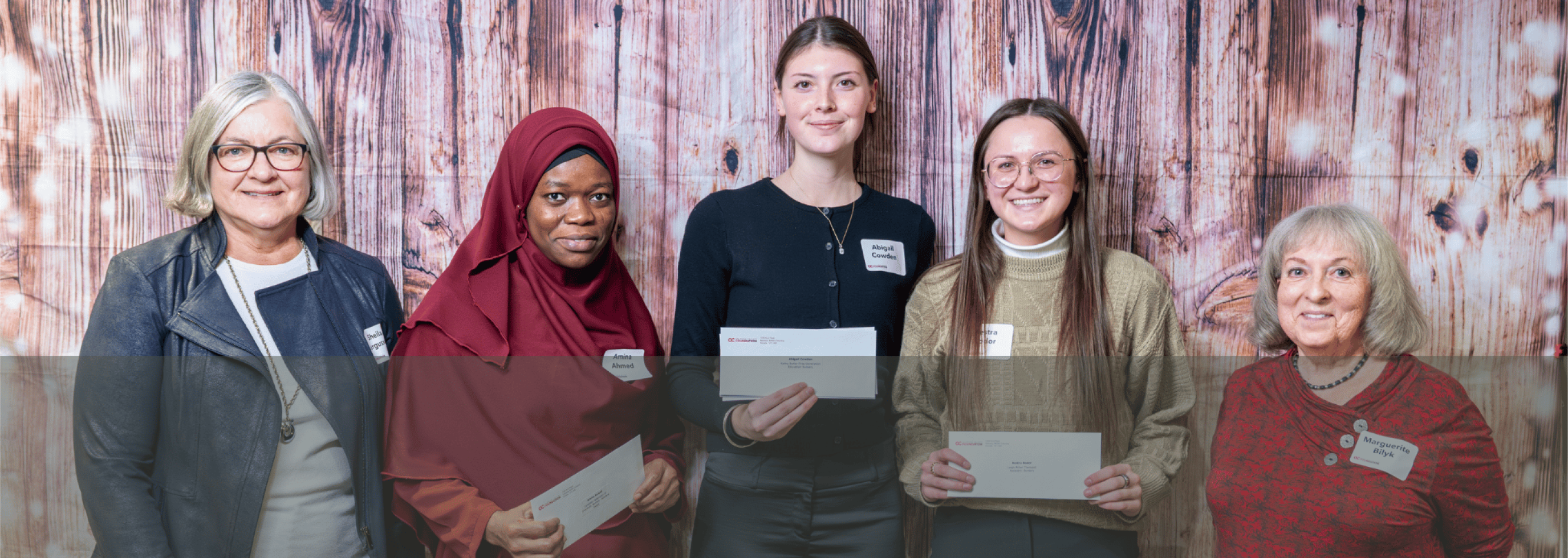 Students and donors posing at an awards reception