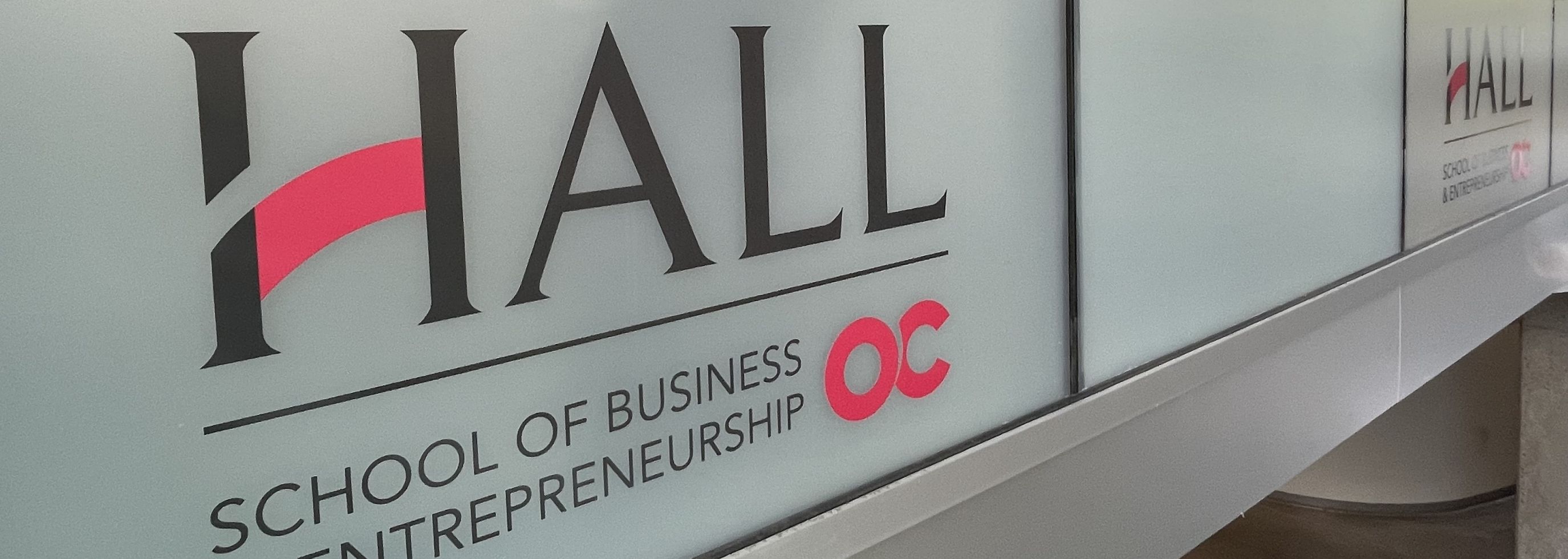 Hall School of Business logo on a classroom at Okanagan College.