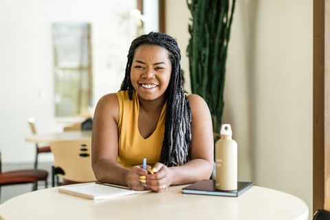 Female student studying at a table