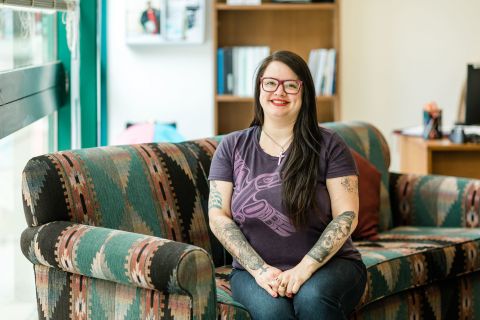 Female student sitting in the Aboriginal gathering place in Penticton