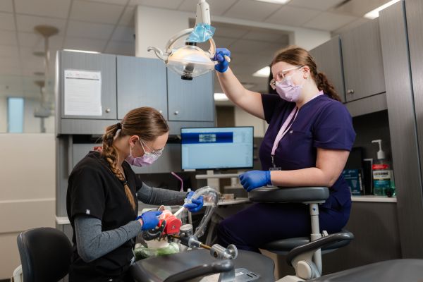 Certified Dental Assistant students work hands-on in clinical environments