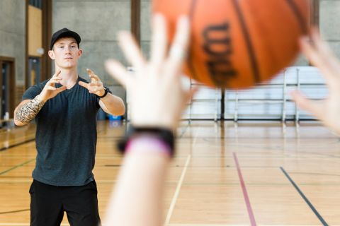Students take a break from studies to play intramurals in the gymnasium