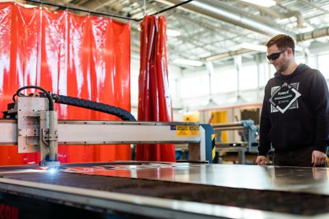 Sheet Metal Working student wearing safety glasses while working with equipment.