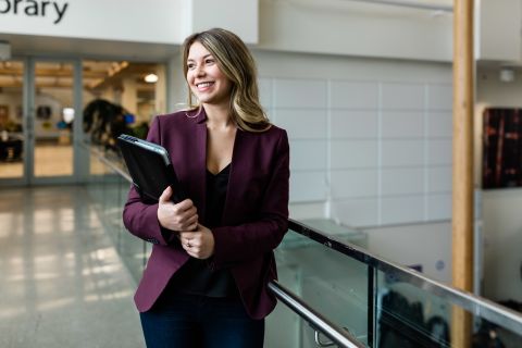 Female student walking with binder
