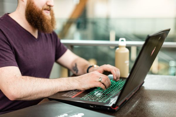 Student types on a laptop