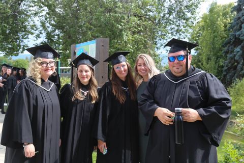 group of graduating students in caps and gowns