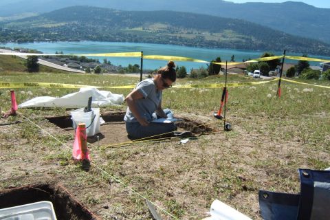 Anthropology student works on an excavation at the Vernon campus while overlooking Kal Lake