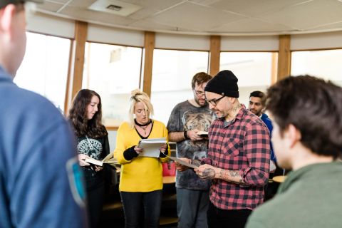 English students rehearse whisper poetry with instructor Jake Kennedy