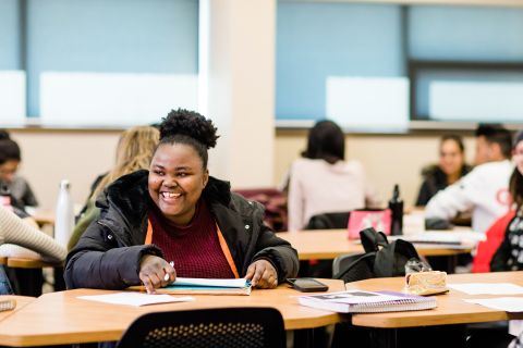 Gender and Women's Studies student laughs at something her classmate says