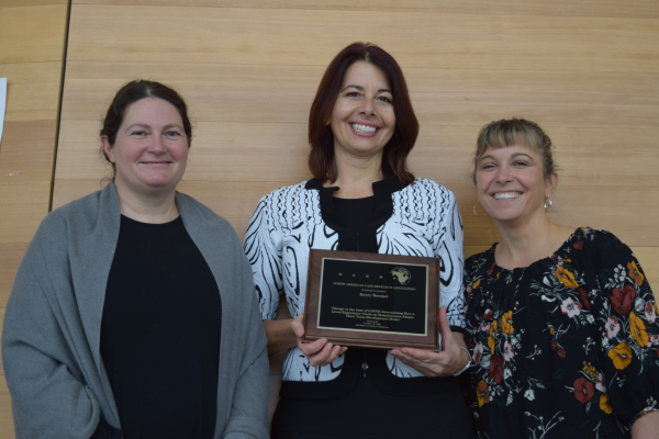 Three Okanagan School of Business professors pose for a photo after winning the bronze medal at the North American Case Conference
