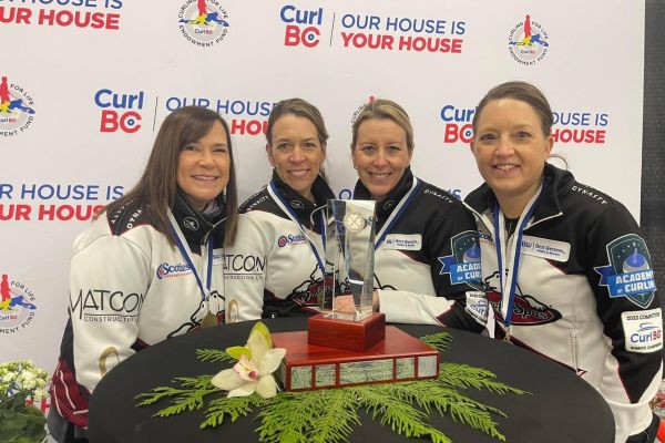 Four women pose with their medals at the BC women's curling provincials.