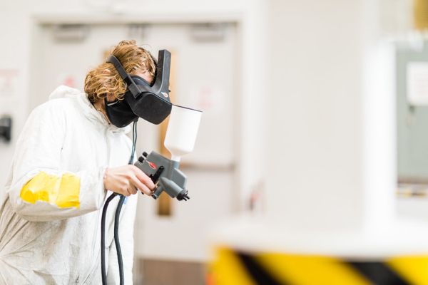 Student using VR technology in the Recreational Vehicle and Collision Refinishing and Painting program