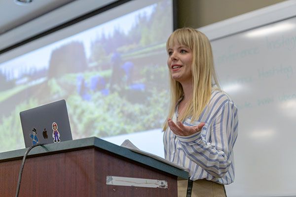 Geography student Chea Elton presents on her research during her graduate studies.