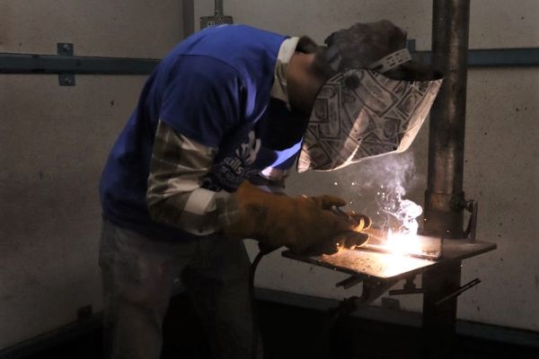 A student welding at Okanagan College