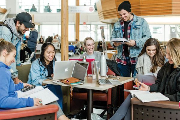 group of students comprised of mixed gender and ages in Centre for Learning Atrium at Okanagan College