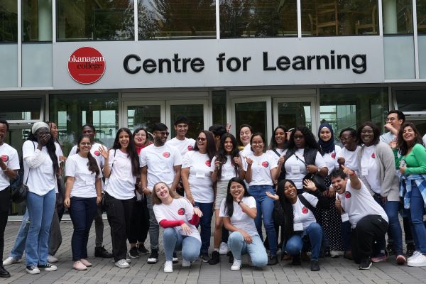 group of students standing outside an Okanagan College building at the Kelowna campus