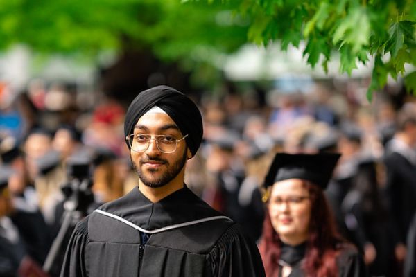 Kelowna students in graduation gowns and caps