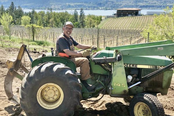 Person smiling on a tractor
