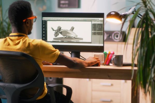 a person designing a game object in a 3D modeling software