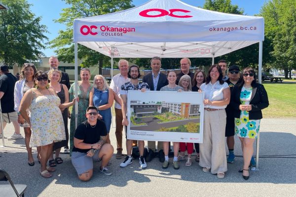 Dignitaries and students from Okanagan College and Penticton community groups and city council gather for a photo after the announcement of a new campus housing building in Penticton.   