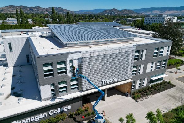 Power washing side of OC Building at Kelowna campus