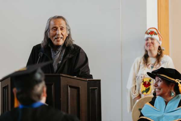 Elder Grouse Barnes addressing the audience at convocation