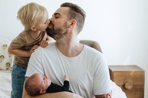 Image of Kelly Loudoun with his two young sons.