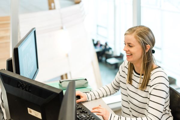 Student looking at two screens
