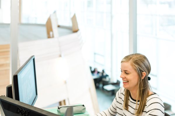 Student looking at two screens