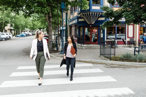 People in business-casual walking.