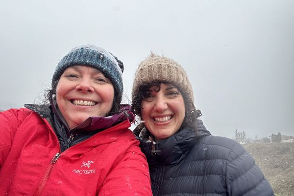 Linda O’Donoghue (right) and Deidre Craig. wearing jackets and hats, smiling outside.