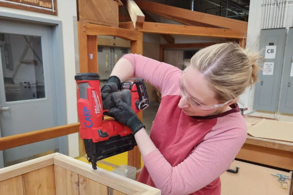 A woman working with a tool