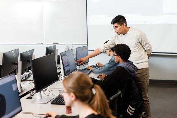student photoshoot - students in front of screens 