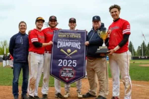 4 seniors receiving championship banner and trophy,  from Left to right, Ethan Skiffington, Teagan Ribbink, Cory Lawson, Adrian Orioli