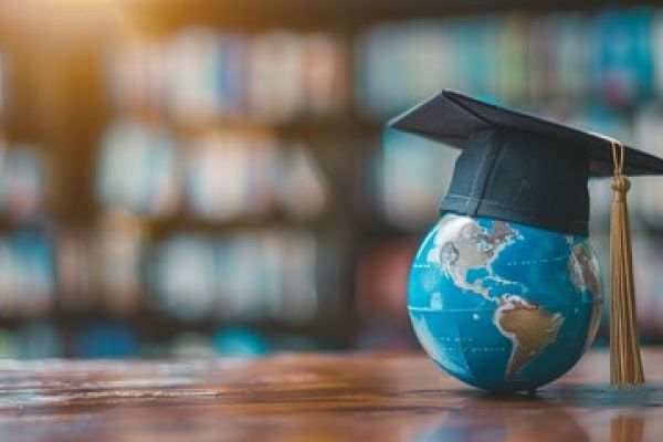 a globe with graduation cap 