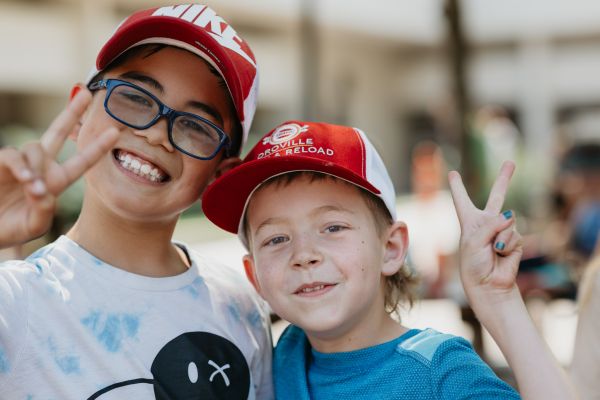 Boys outside with peace fingers