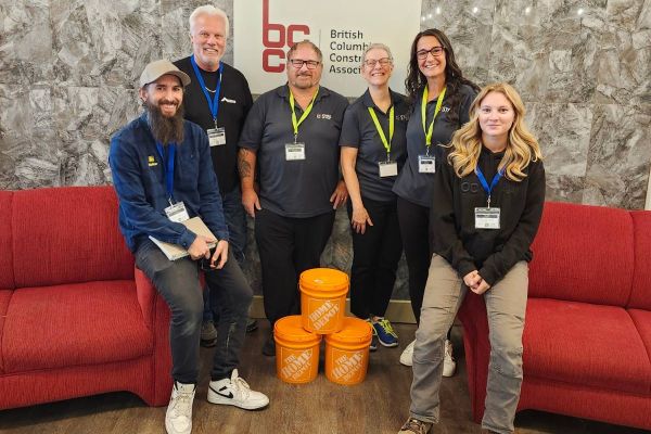 Graham Booth (far left) and Miranda Allen (far right) with Greyback Construction