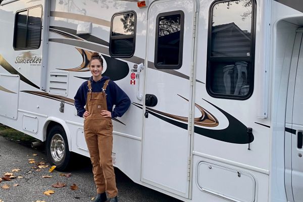 Katelyn DiMarcello standing in front of an RV